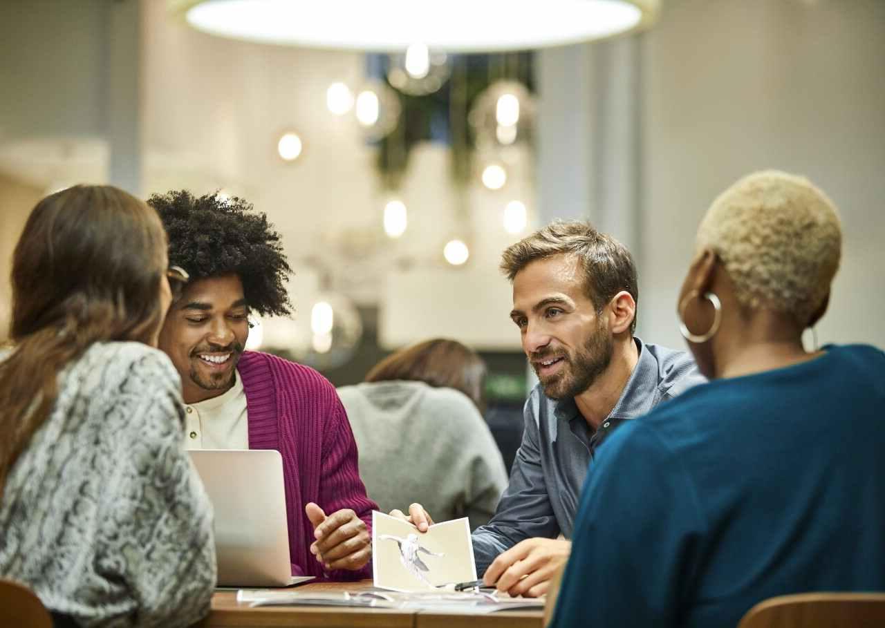 Multi-ethnic coworkers discussing in office