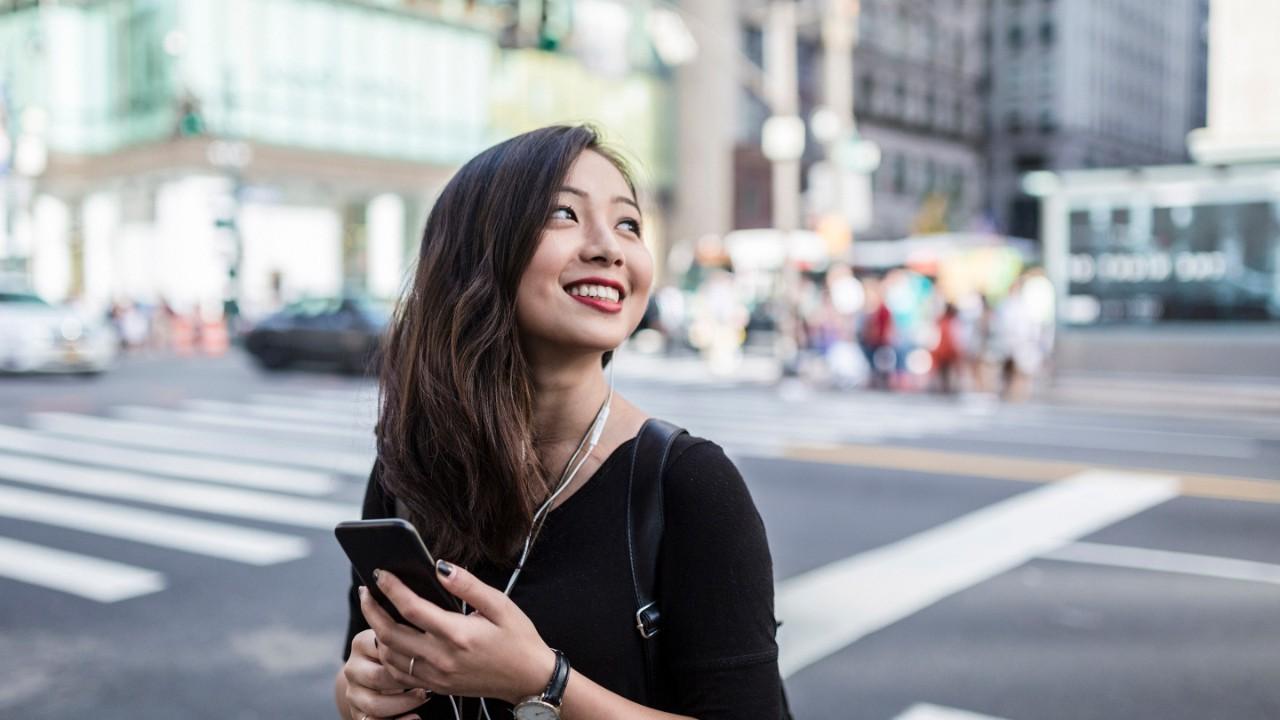 Fashionable young asian woman commuting in the streets of Manhattan (travel, journey, commute,tourism, walk,city life)